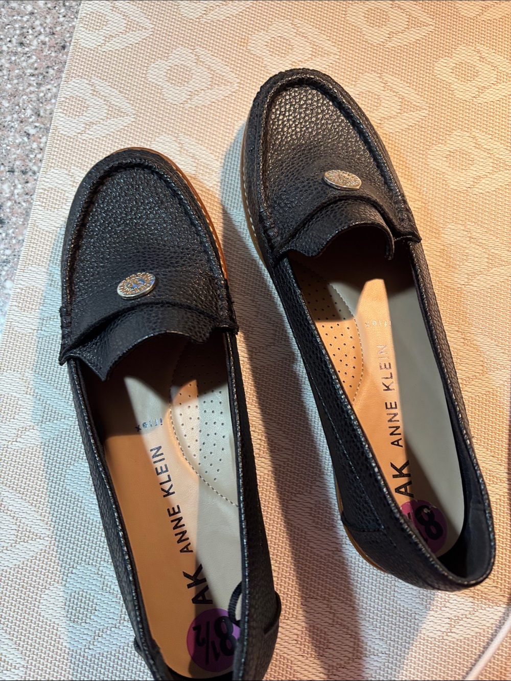 Anne Klein Black Textured Leather Penny Loafers with Medallion